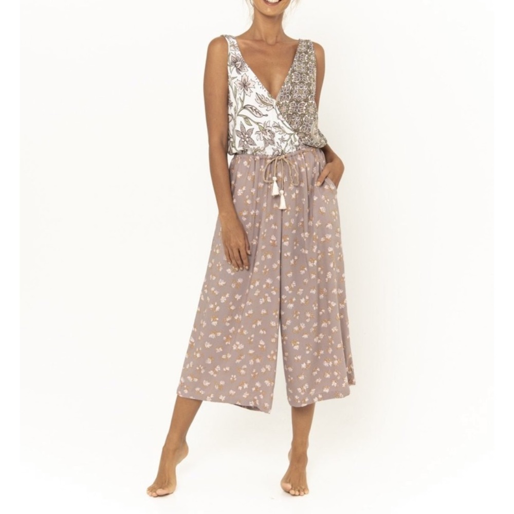 effortless jumper features a V neckline and V back with pockets +extra wide leg